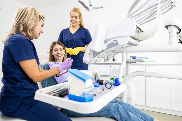 female dentist with assistant working in dental cl 2023 11 27 05 33 55 utc